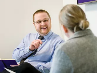 Man and woman having a fun team meeting