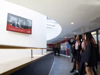 Students looking at message on screen