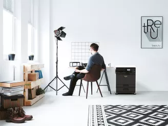 Photographer sitting at desk