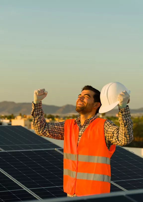 Happy Solar Professional Holds Fists Up