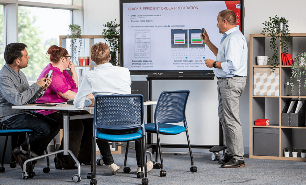 Small group of colleagues at training session