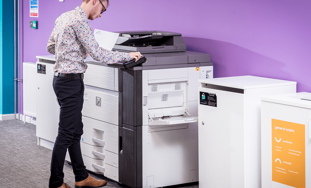 Man printing document in office