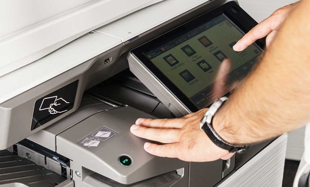 Man using a software on black and white printer