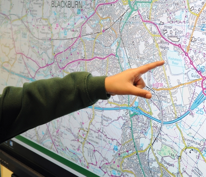 A pupil using a Sharp interactive display during a lesson