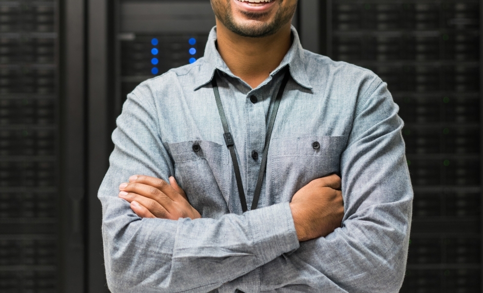 Man smiling in server room